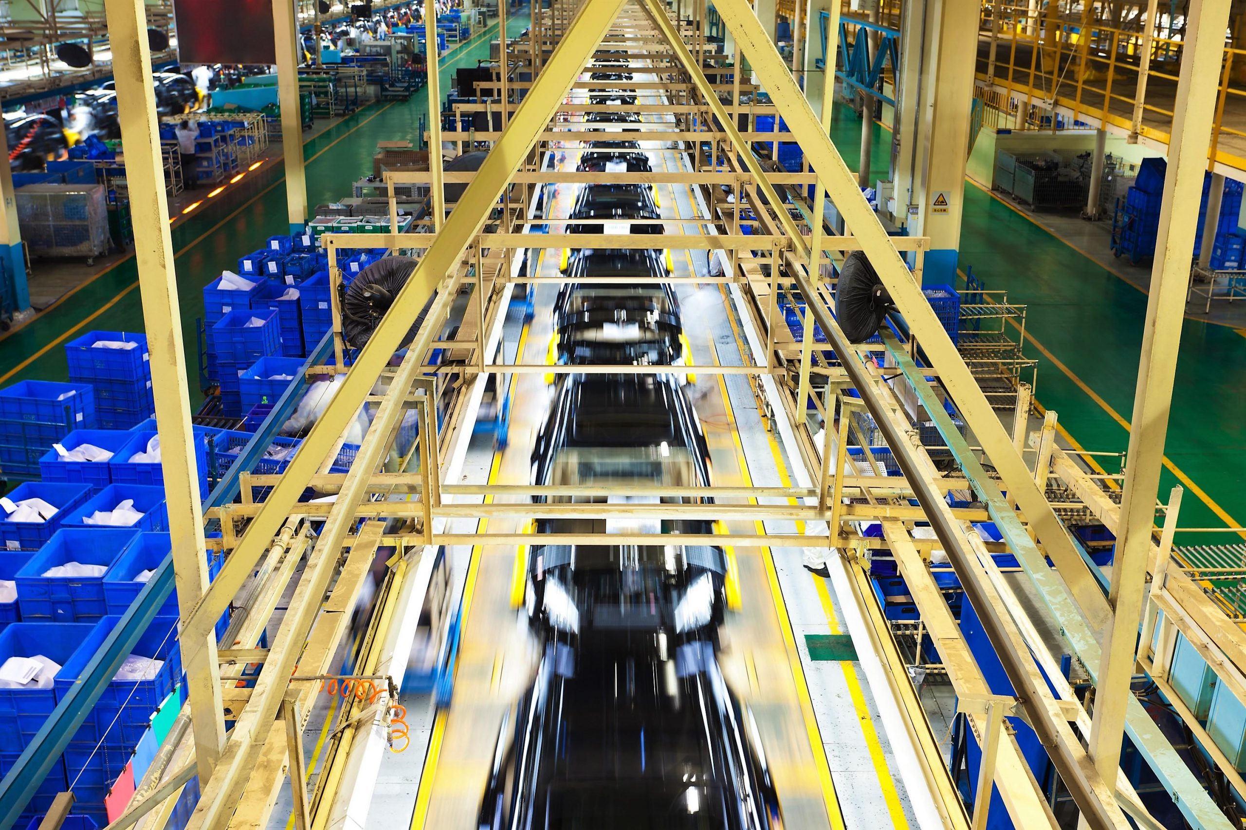 cars moving across manufacturing line