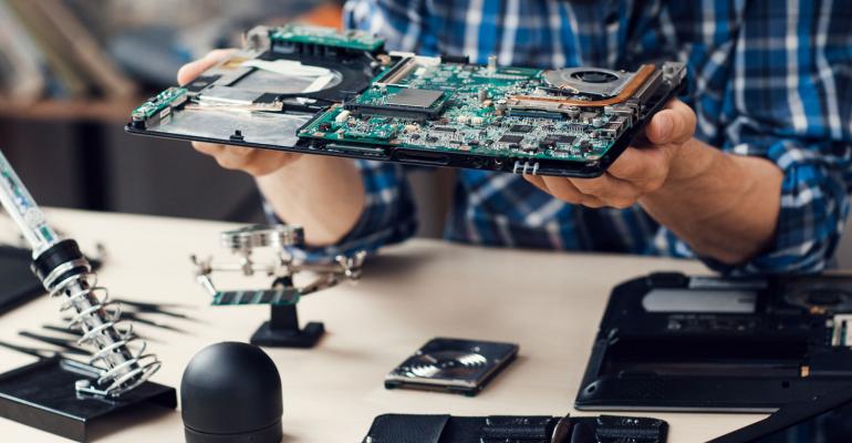 an engineer checking the central processing unit (cpu) of the computer