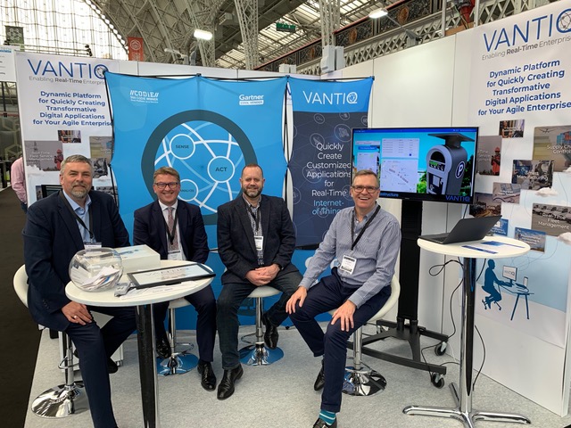 Scott Yarnell, Mark Munro, Clinton James and Henry Blythe sitting at VANTIQ booth at IoT tech expo at London, UK