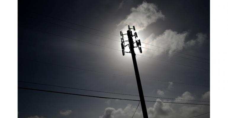 telephone pole with sun shadow in background