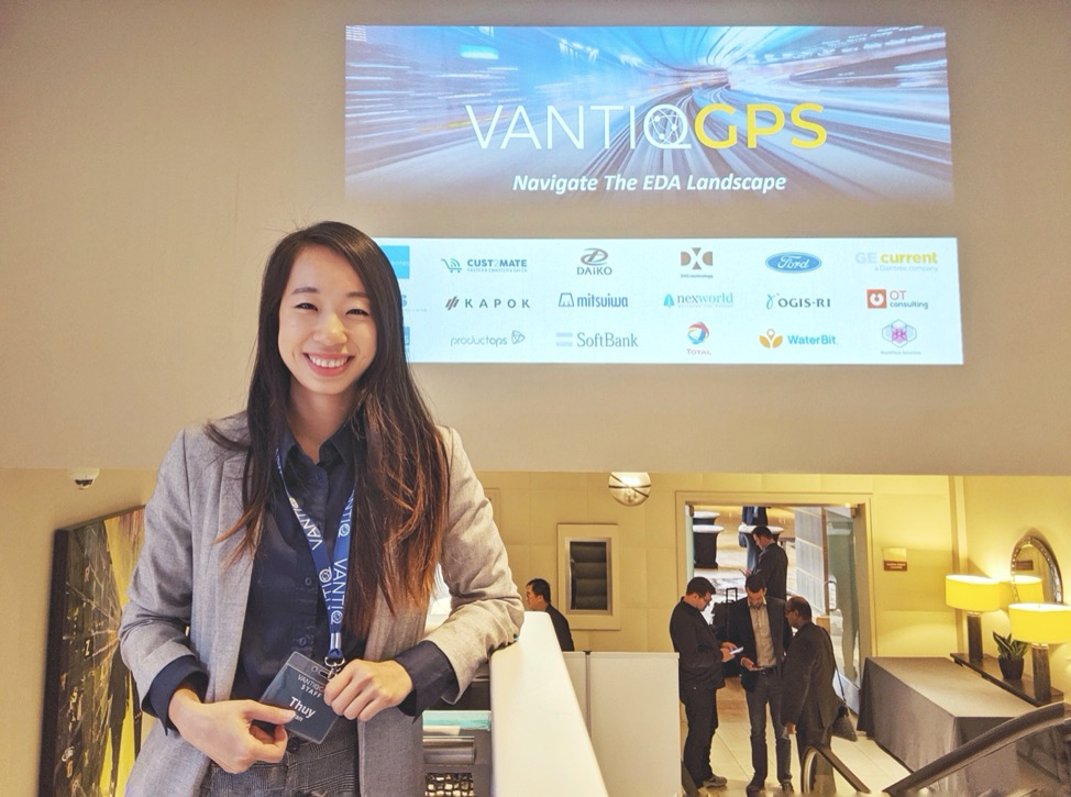 Thuy Tran standing in front of VANTIQ GPS sign