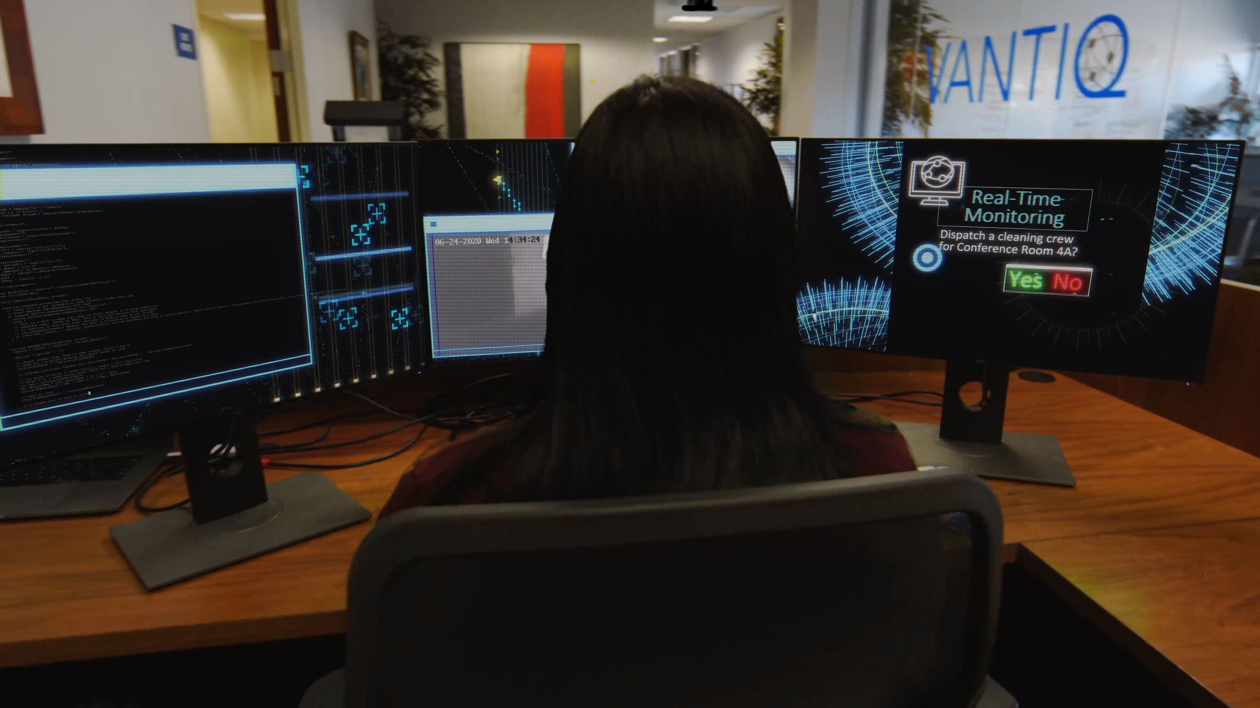 Office manager sitting in front of office dashboard